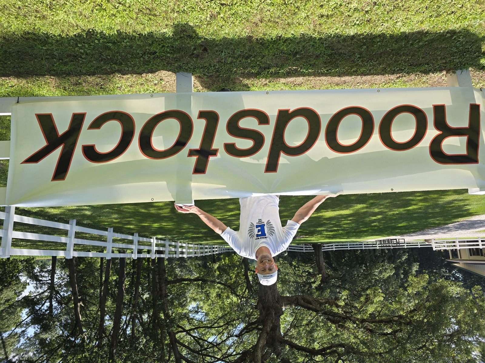 Wooden Roodstock sign on the fence at the farm